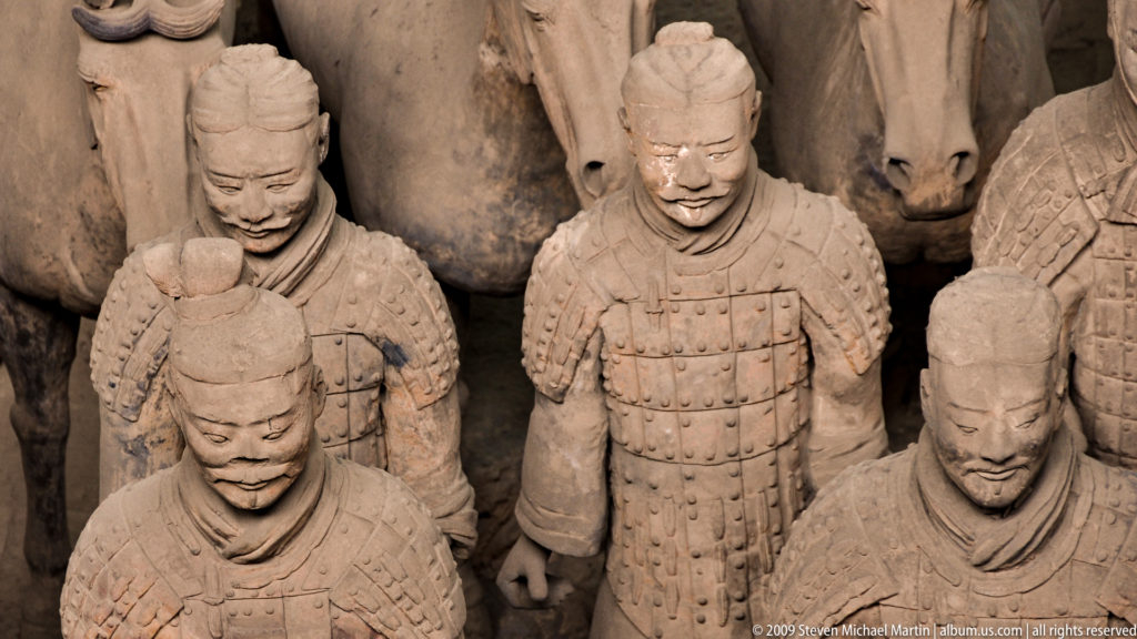 Front-facing armored terracotta infantry in close formation, part of the Terracotta Army near Xi'an.