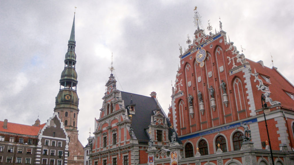 House of the Blackheads and adjoining gabled buildings with St. Peter’s Church tower rising at left.
