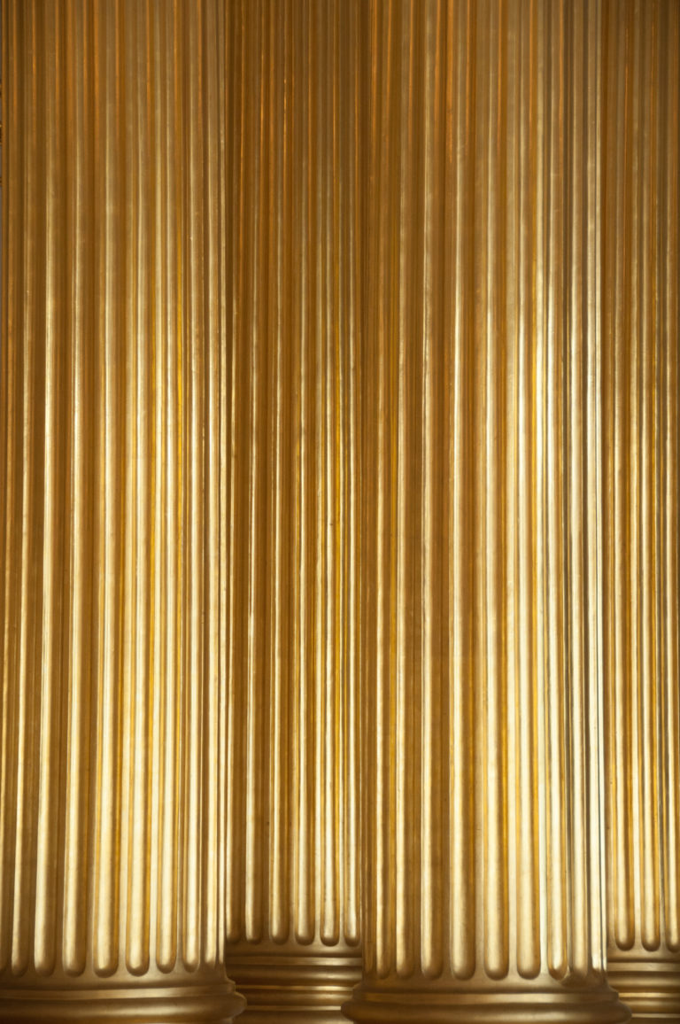 Close detail of monumental gilded fluted column shafts in the Winter Palace’s Armorial Hall.