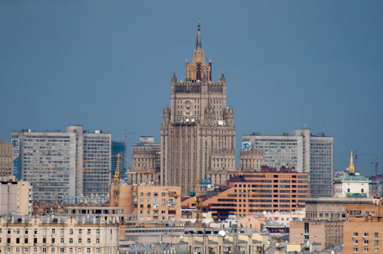 Russian Ministry of Foreign Affairs high-rise with ornate stepped crown and spire above surrounding Moscow buildings.
