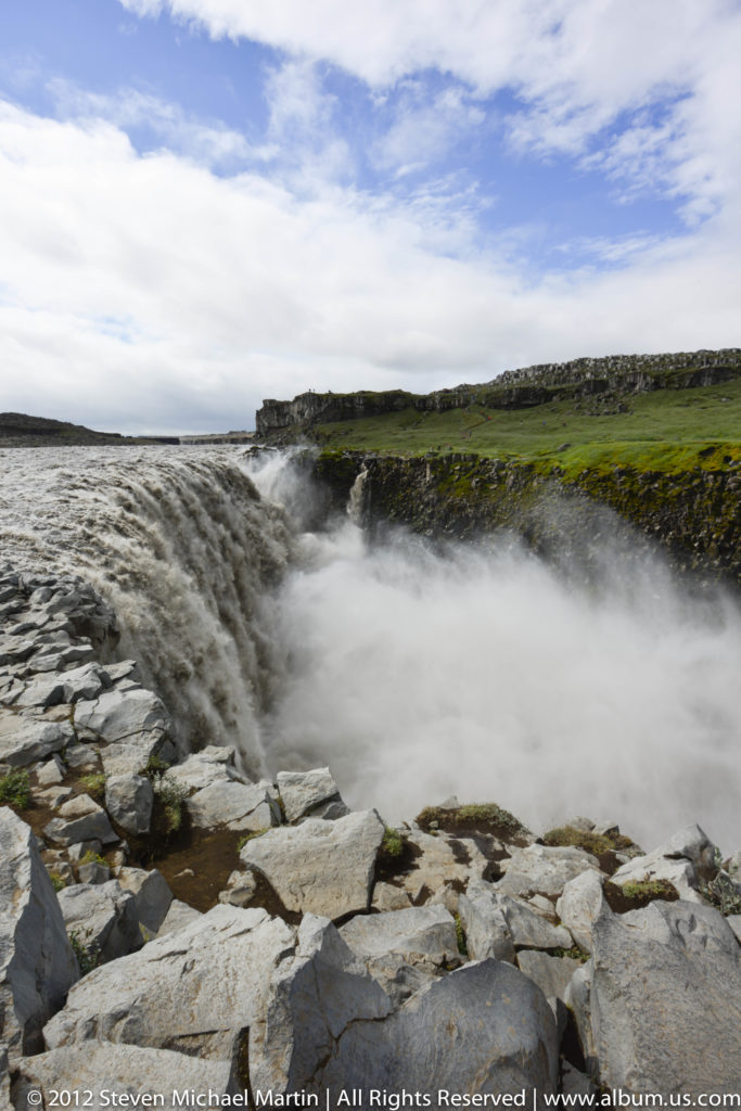 Panoramic view of Goðafoss spreading across dark basalt shelves on the Skjálfandafljót River.
