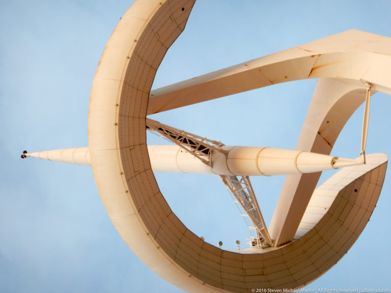 Extreme low-angle view into the circular crown and supports of the Montjuïc Communications Tower.