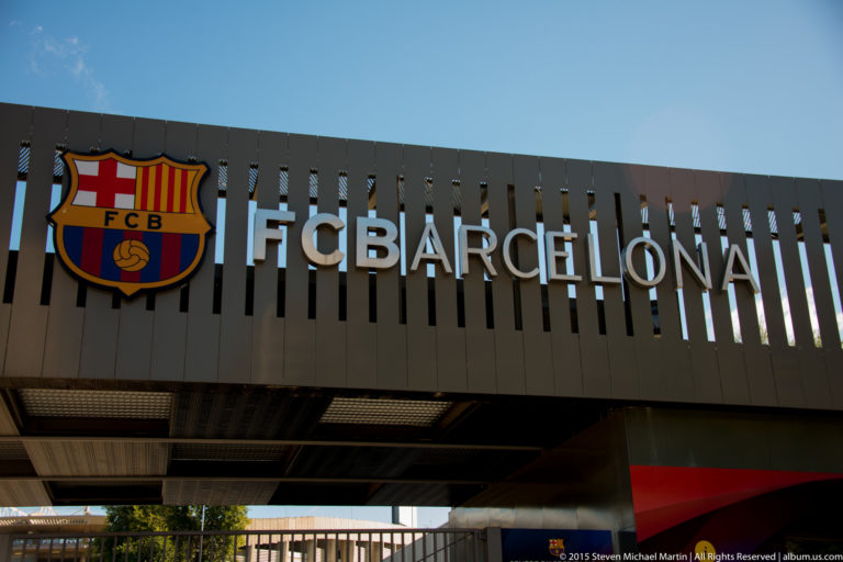 FC Barcelona crest and large lettering mounted on the exterior of Camp Nou.