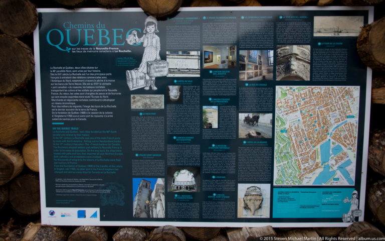 Large historical interpretation panel with French text, archival images, drawings, and a detailed map of La Rochelle.