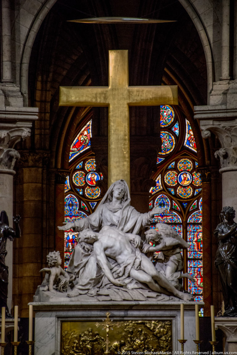 Nicolas Coustou’s white-marble Pietà with the Virgin supporting the dead Christ beneath a large cross.