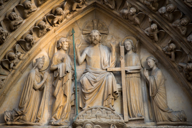 Tympanum of Notre-Dame’s Last Judgment Portal with enthroned Christ above carved figures and archivolts.