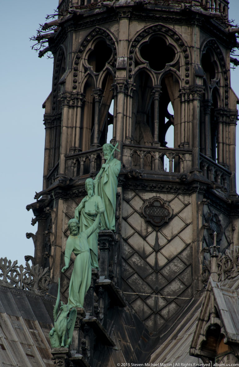 Green-patinated copper apostle figures around the base of Notre-Dame’s former Viollet-le-Duc spire.