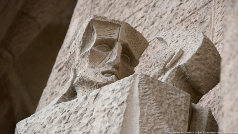 Close-up of Jesus and Judas face to face in Subirachs’s Kiss of Judas sculpture on the Passion façade.