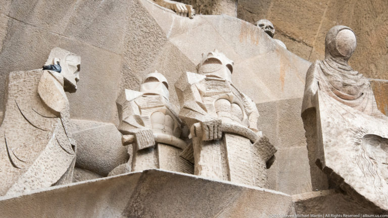 Roman soldiers and the faceless Saint Veronica in Subirachs’s Way to Calvary group on the Sagrada Família Passion façade.
