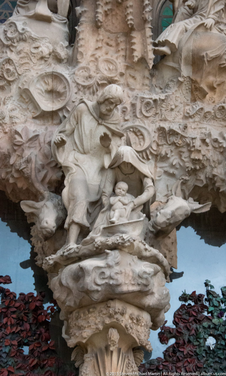 Mary with the infant Jesus and Joseph, flanked by the ox and mule, in the Nativity group on the Portal of Charity.