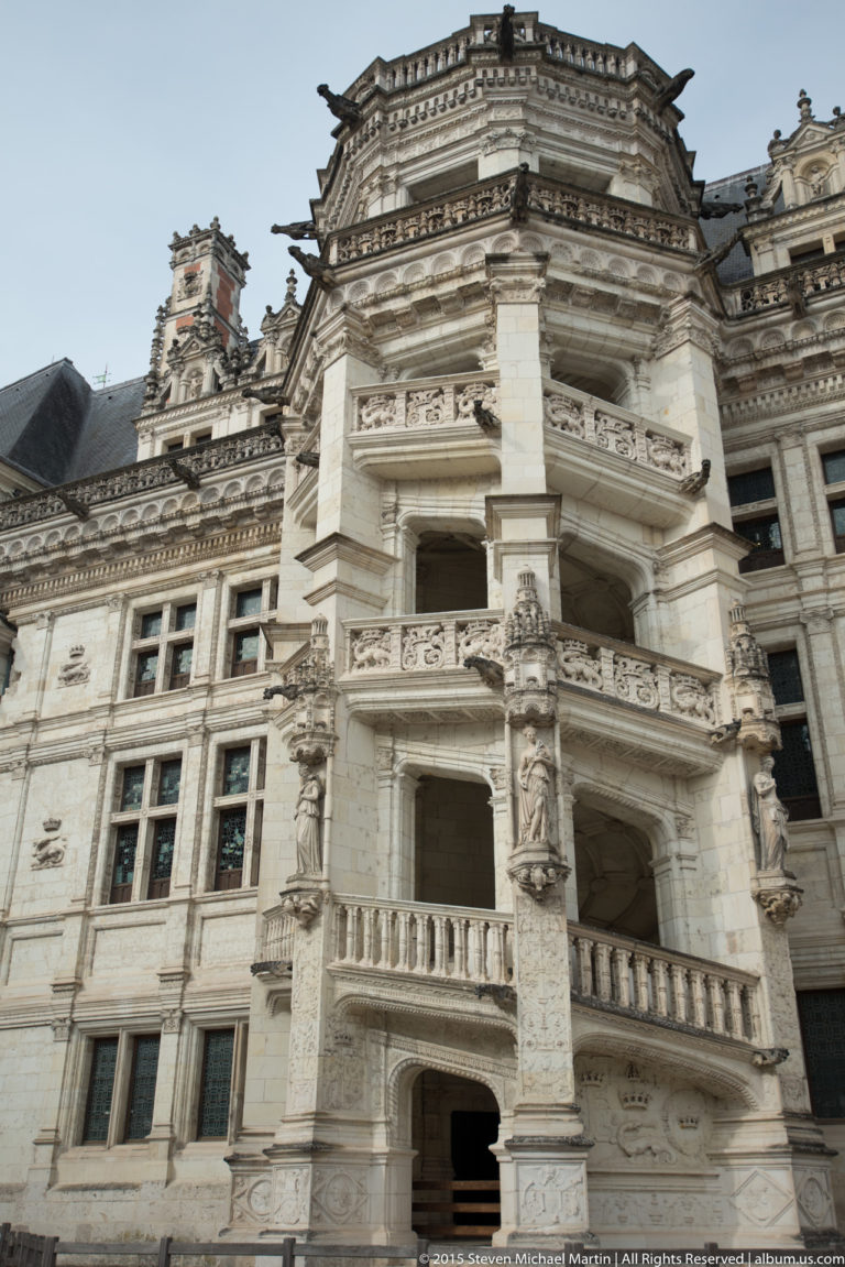 Close view of the François I exterior spiral stair tower with carved balconies and balustrades at Blois château.