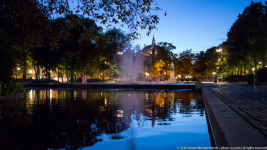 View of National Theatre from Sculpture at Spikersuppa Ice-Skating Rink (a fountain in summer) by Steven Michael Martin