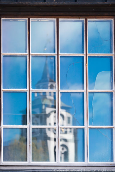 Reflection of Roros Church in window by Steven Michael Martin