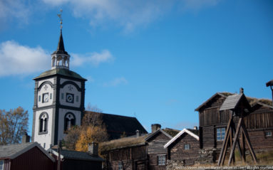 Roros Church among buildings by Steven Michael Martin