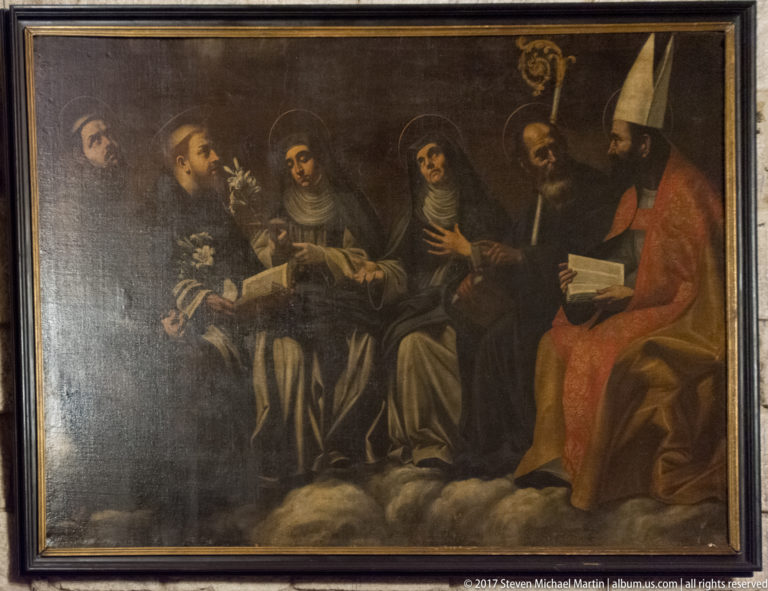 Dark religious painting of several haloed clerics gathered around a seated bishop in a mitre holding a book.