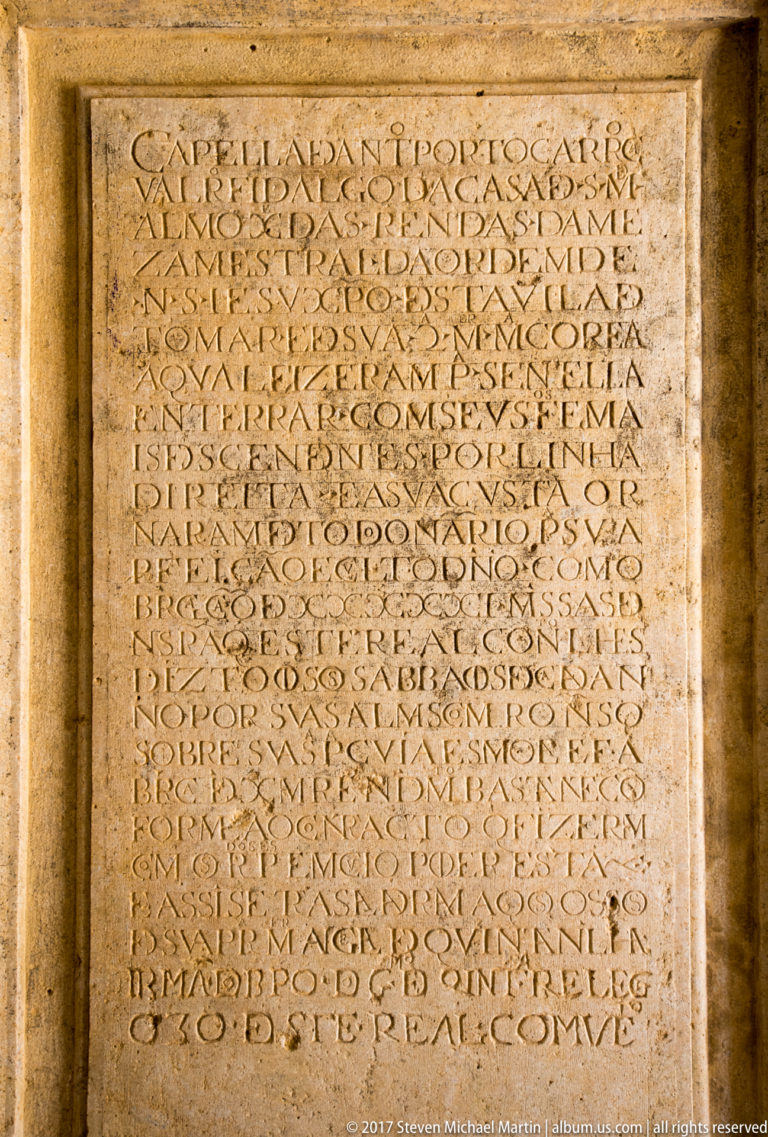 Large rectangular stone tablet densely carved with many lines of Latin capital lettering inside a molded frame.