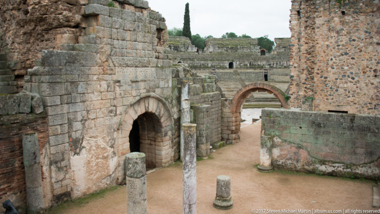 Roman stone and brick passages with several standing column shafts and layered archaeological walls.