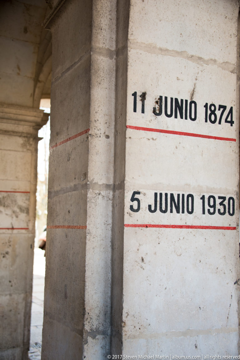 Stone pier marked with red lines and the dates 11 June 1874 and 5 June 1930.