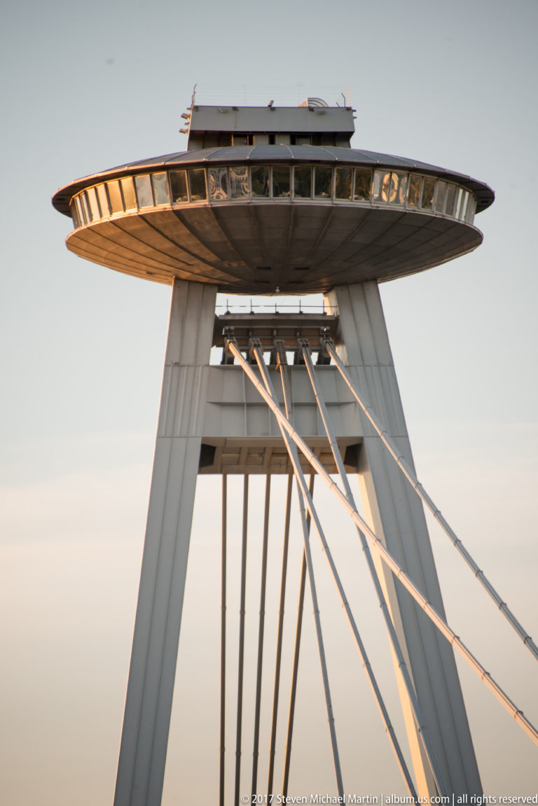 Upward view of Most SNP pylon legs, suspension cables, and saucer-shaped UFO observation deck.