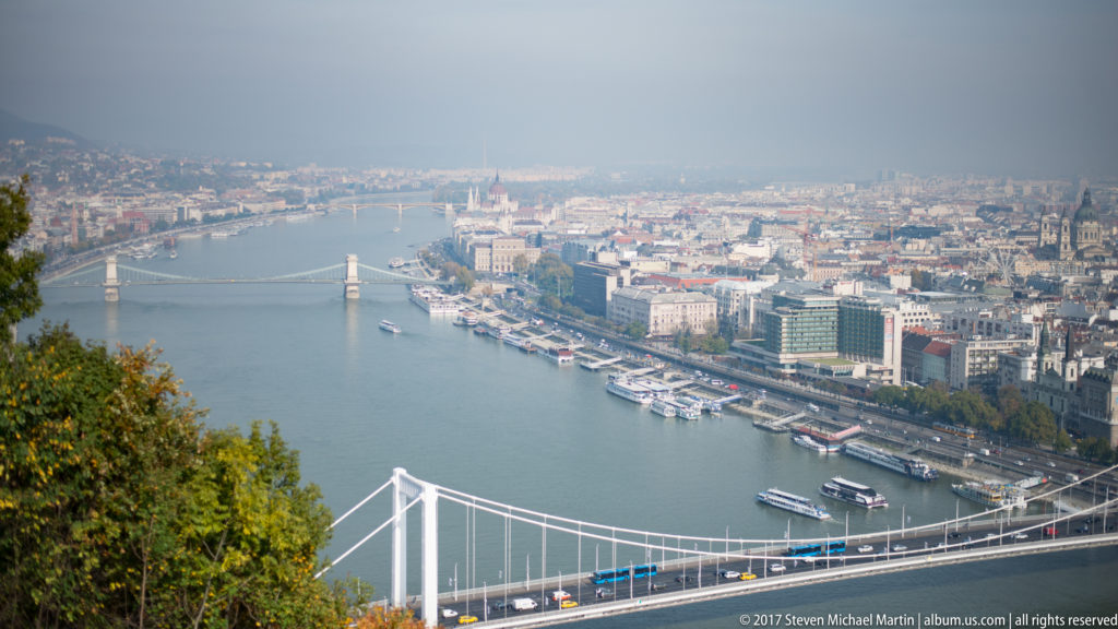 Elevated view from Gellért Hill over Elisabeth Bridge, the Danube, riverboats, and central Pest.