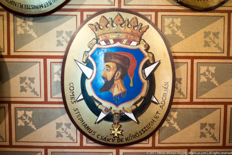 Heraldic oval portrait of a bearded nobleman beneath a crown, with Latin inscription naming Stephanus Csáky.