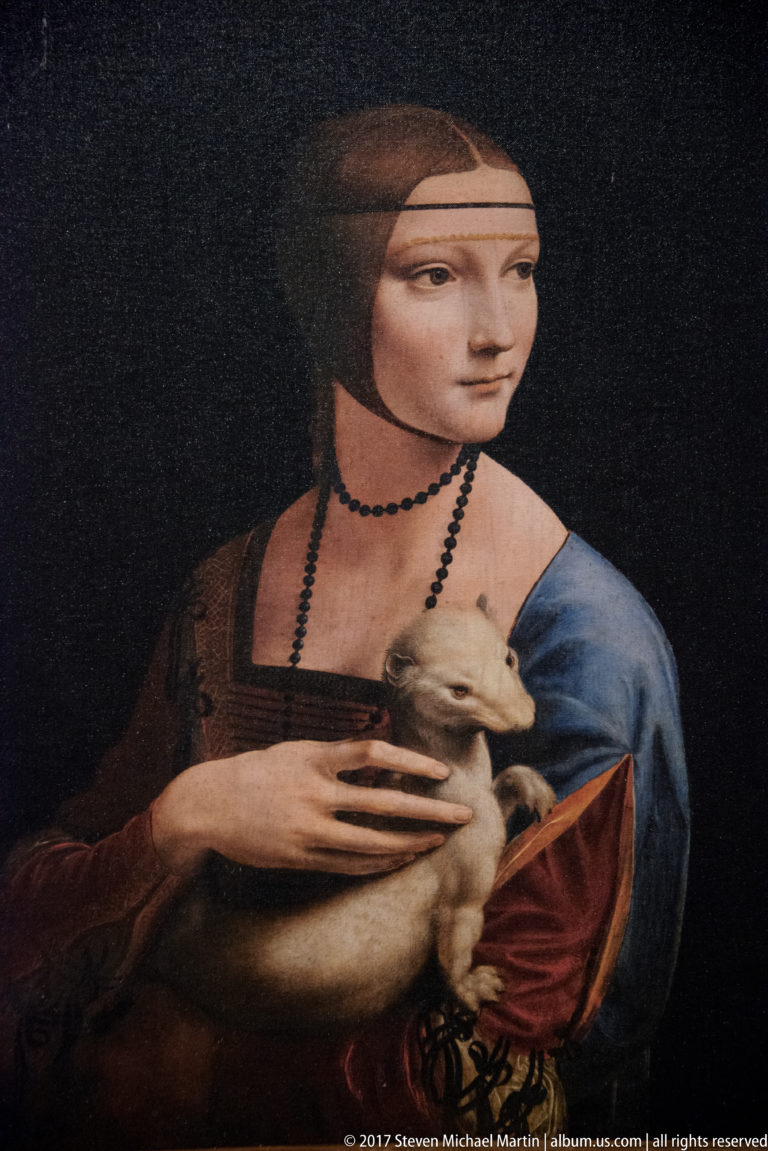 Leonardo da Vinci’s Lady with an Ermine, showing Cecilia Gallerani in three-quarter view holding a white ermine against a dark background.