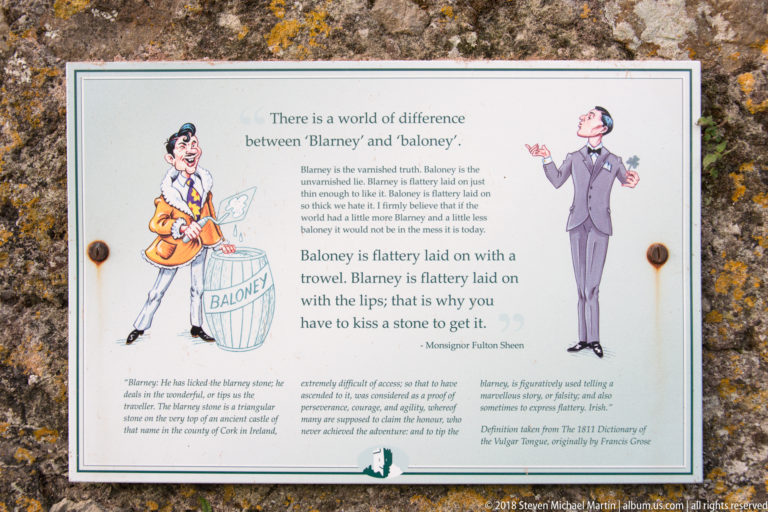 Wall-mounted interpretive sign comparing “Blarney” and “baloney,” with explanatory text and two illustrated figures.