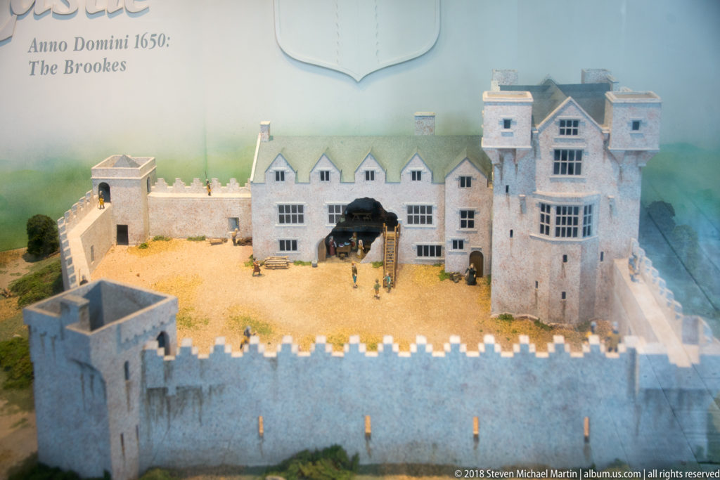 Scale model of Donegal Castle showing a crenellated courtyard wall, multi-gabled residence, tower, and miniature figures.