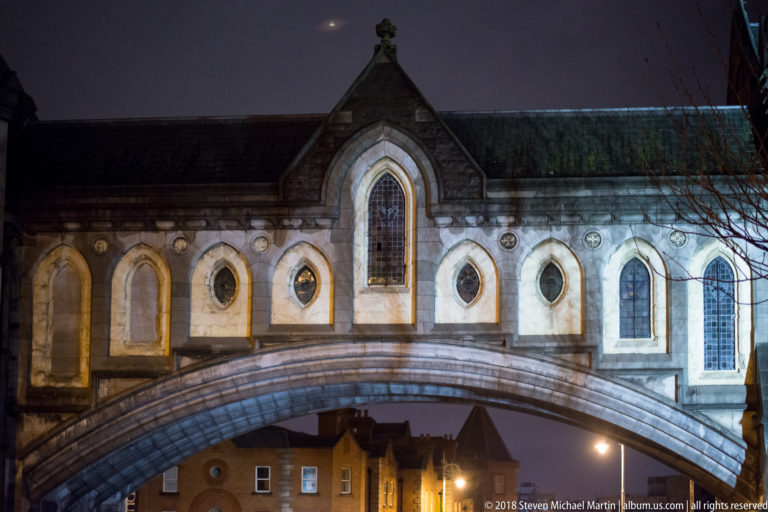 Enclosed historic bridge with Gothic-style windows crossing a Dublin street near Christ Church Cathedral and Dublinia.