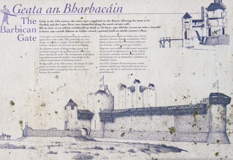 Interpretive panel titled “Barbican Gate,” with a large historic reconstruction drawing of a fortified gate and smaller architectural diagrams.