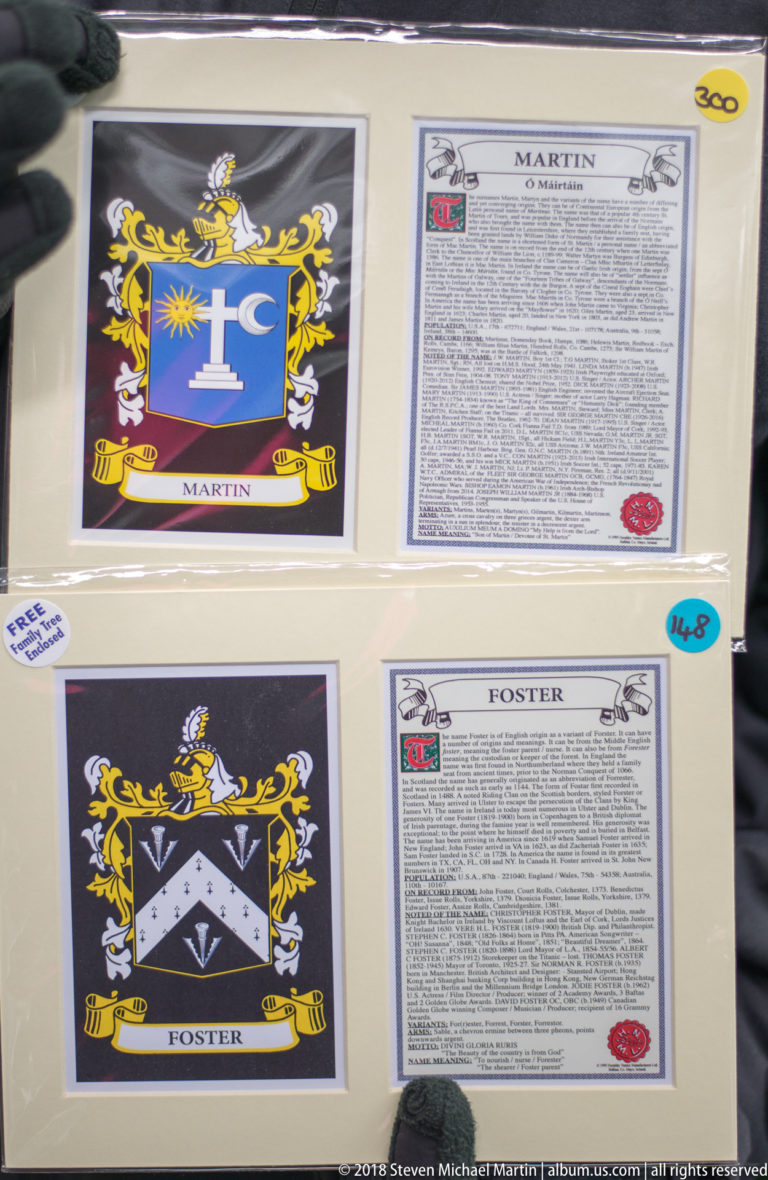 Mounted Martin and Foster surname prints with heraldic-style crests and accompanying family-history text.