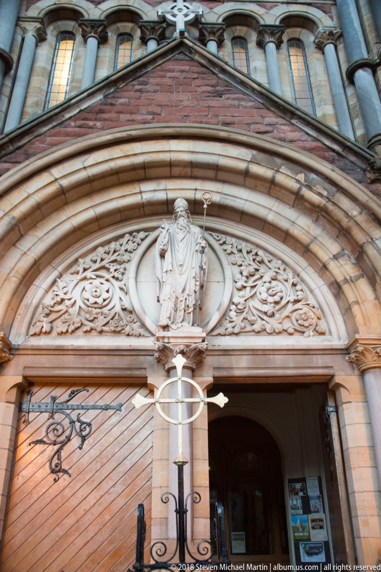 Entrance of St Patrick’s Church, Donegall Street, with the Portland-stone statue of St Patrick centered above the doors.