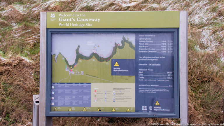 World Heritage Site information panel with coastal map, route markings, safety warnings, and visitor guidance.