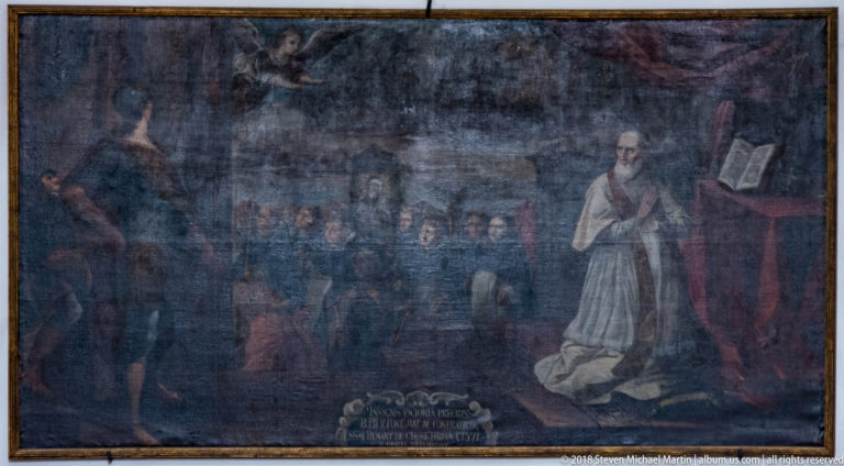 Dark church painting with rows of clergy, a kneeling ecclesiastical figure, and a standing cleric holding an open book.