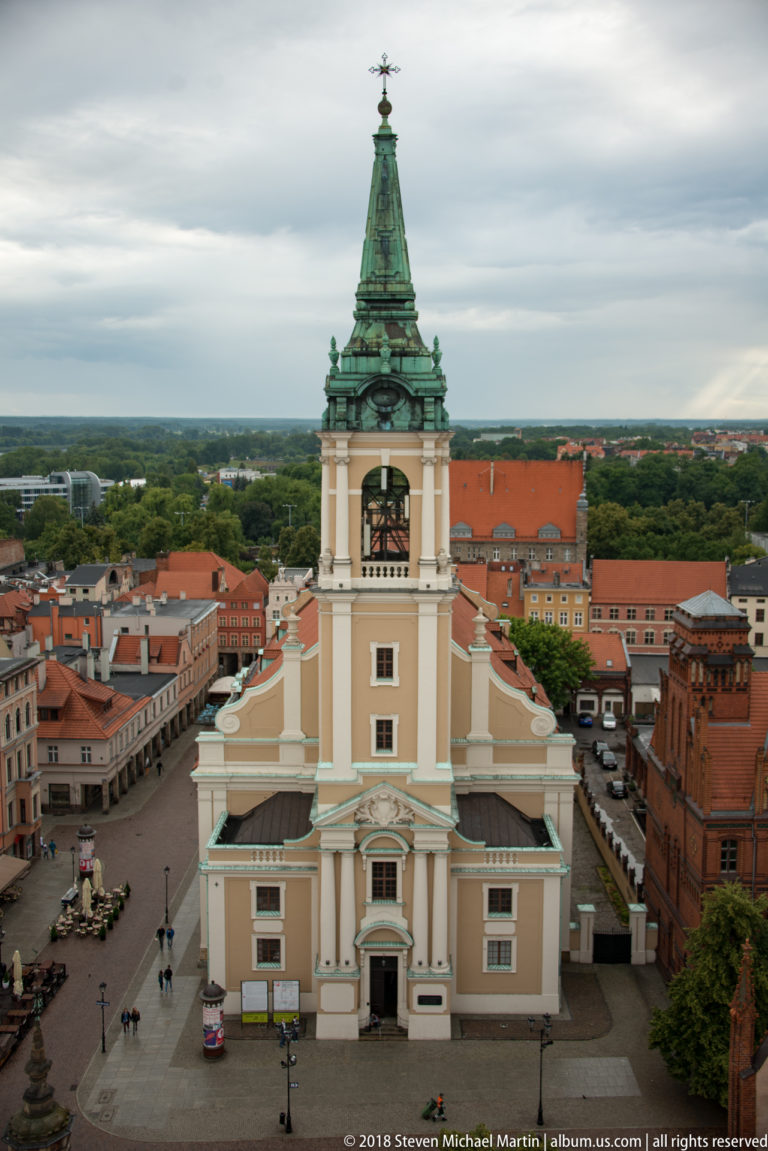 Elevated view of the Church of the Holy Spirit and surrounding Toruń market square.