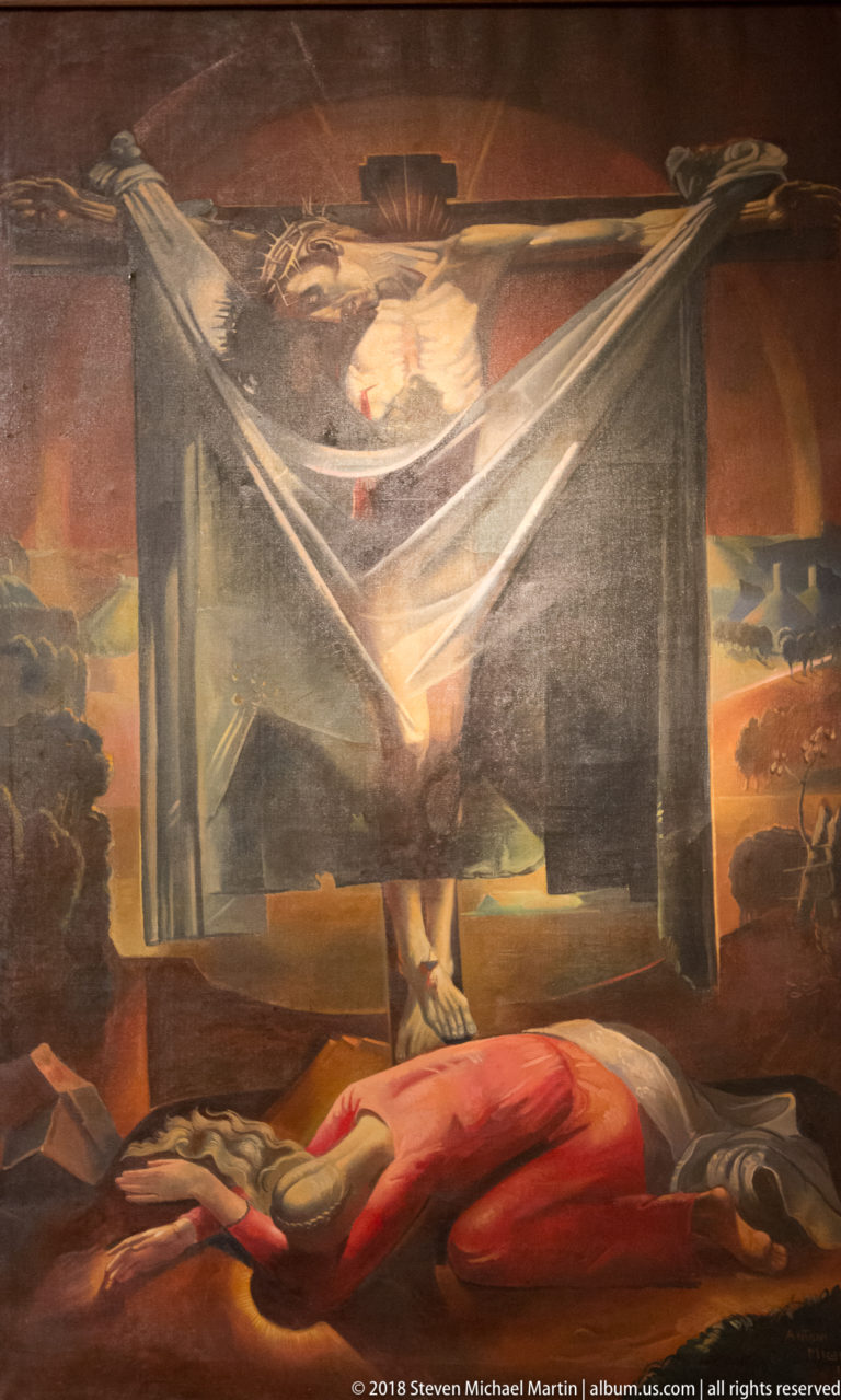 Religious painting with a reclining red-clad figure below a dark suspended veil and a luminous sacred face or figure above.