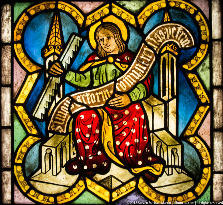 Saint Simon the Zealot seated with a large saw and inscribed ribbon.