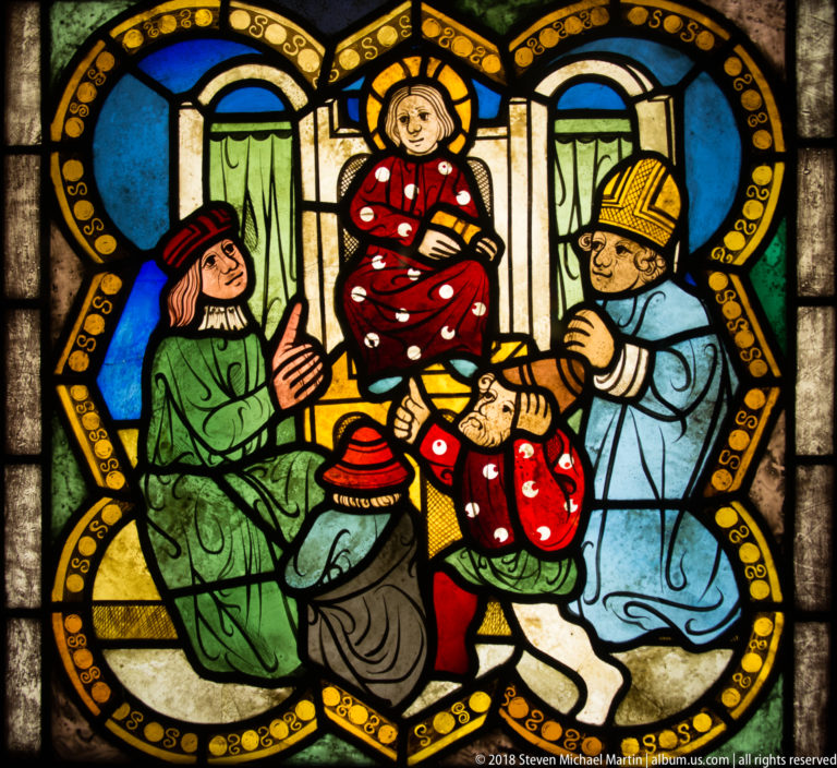 Haloed child elevated between a kneeling figure and a mitred bishop in a crowded medieval stained-glass interior.