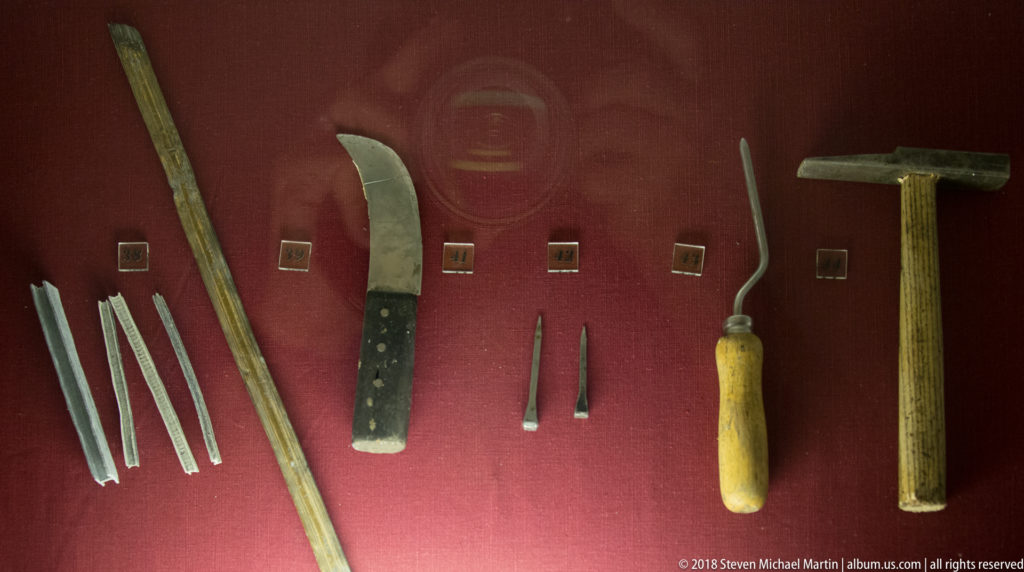 Traditional stained-glass hand tools for cutting, shaping, fitting, and assembling pieces of glass and lead.