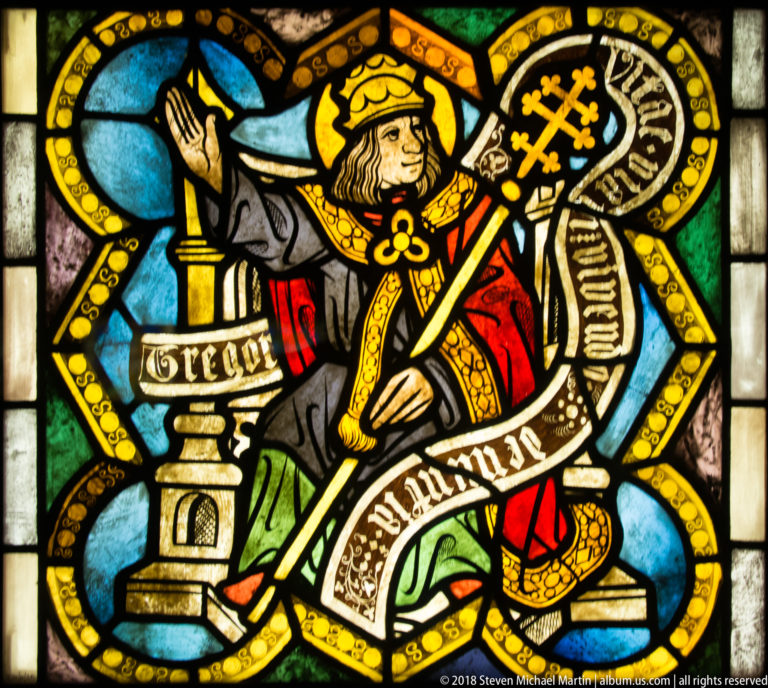 Saint Peter seated with a monumental key-like attribute and an inscribed Apostles' Creed ribbon.