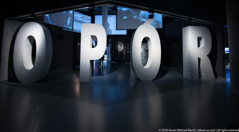 Large freestanding letters spelling TERROR at the entrance to a dark museum exhibition section.