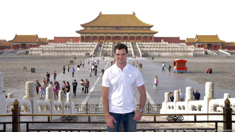 Full-length portrait of a male visitor in a white shirt standing in the courtyard before the Hall of Supreme Harmony in Beijing’s Forbidden City.