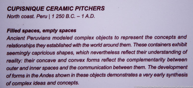 Museum panel titled “Filled spaces, empty spaces,” explaining concave and convex forms in ancient Peruvian ceramic pitchers.