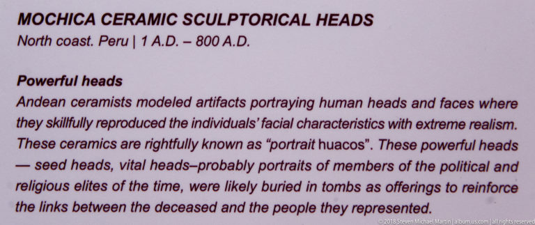 Museum panel titled for Mochica ceramic sculptural heads, explaining realistic portrait huacos from Peru’s north coast, about 1–800 CE.