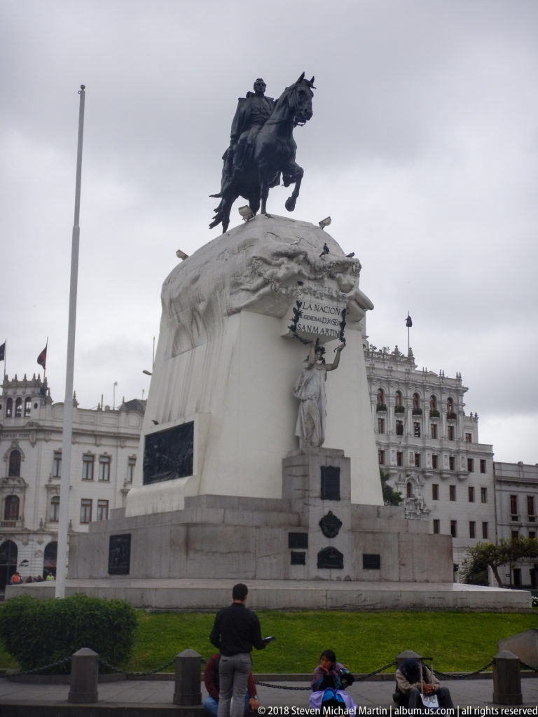 Equestrian monument to José de San Martín on a tall white sculptural pedestal in Lima’s Plaza San Martín.