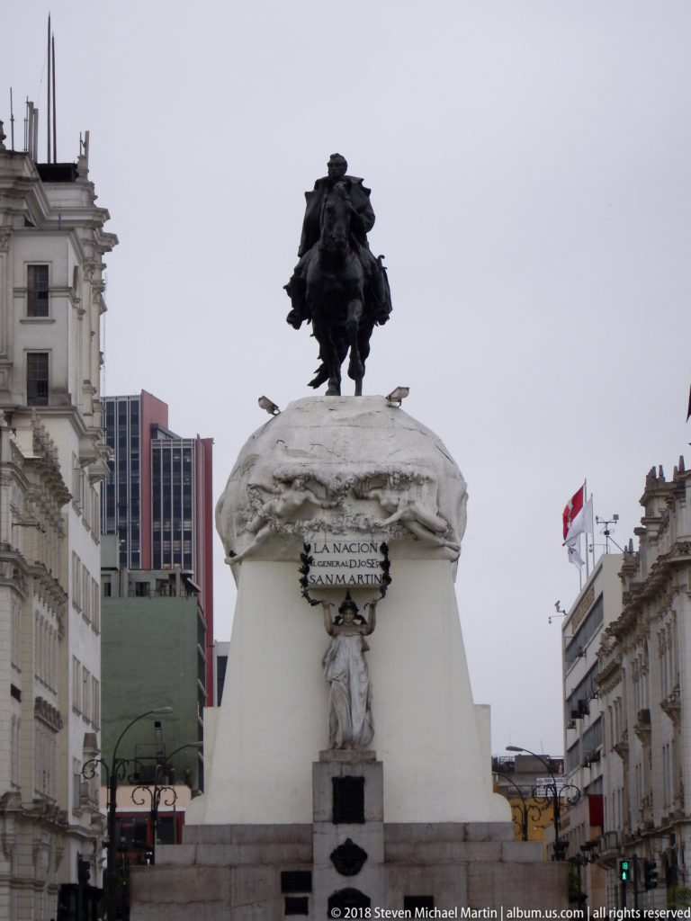 Equestrian monument to José de San Martín on a tall stone pedestal in Plaza San Martín, Lima.