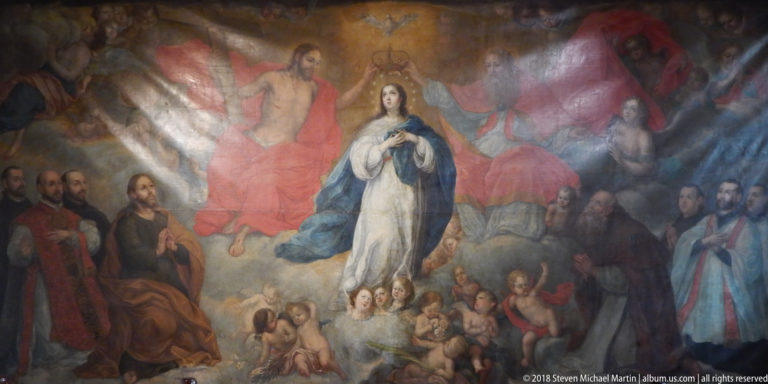 Virgin in blue and white rises among cherubs, apostles, clerics, and red-robed heavenly figures in a large devotional painting.