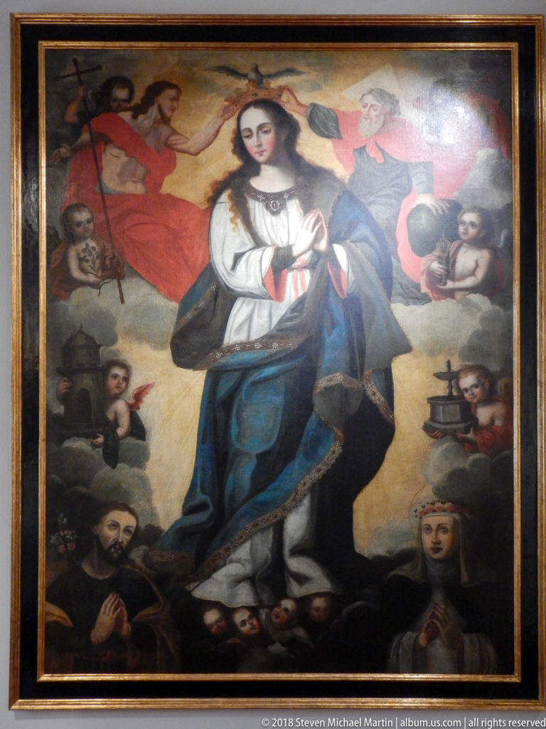 Virgin in white and blue stands prayerfully in a religious painting surrounded by clerics, saints, and symbolic objects.
