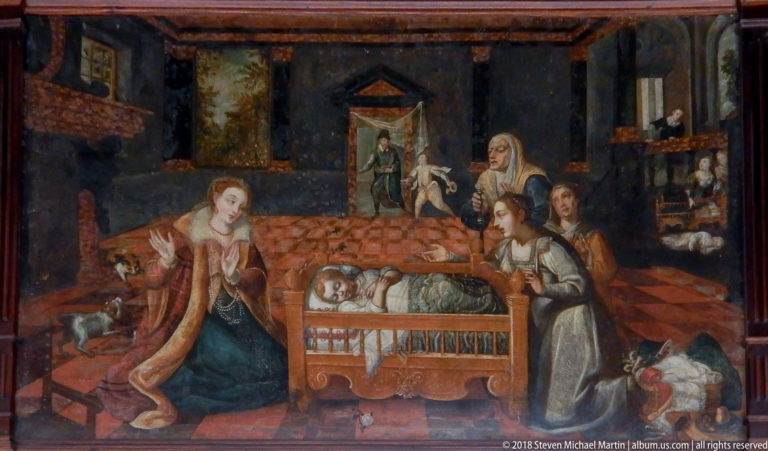 Religious painting of an infant in an ornate cradle surrounded by kneeling and standing women in a dark interior.