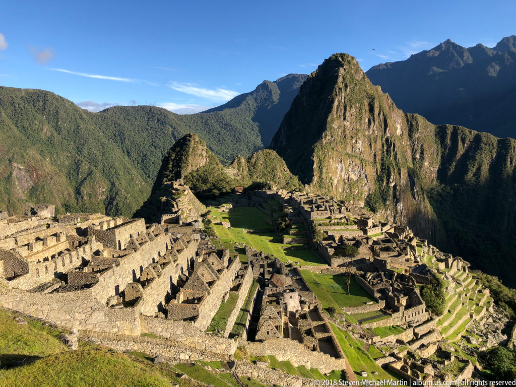 Classic panorama of Machu Picchu’s stone compounds, green terraces, and Huayna Picchu.